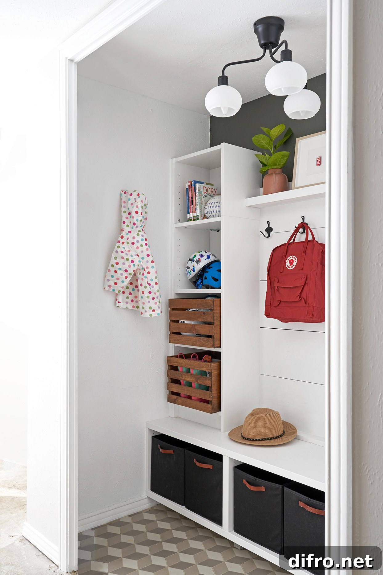 Entryway with large built-in storage for hats, bags, and coats.