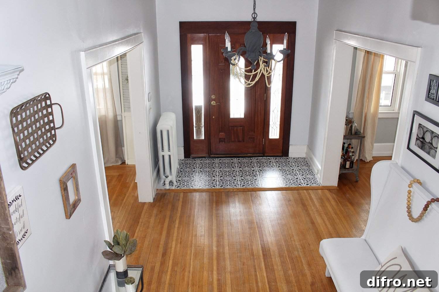 Entryway with a tile splash in front of the main door.