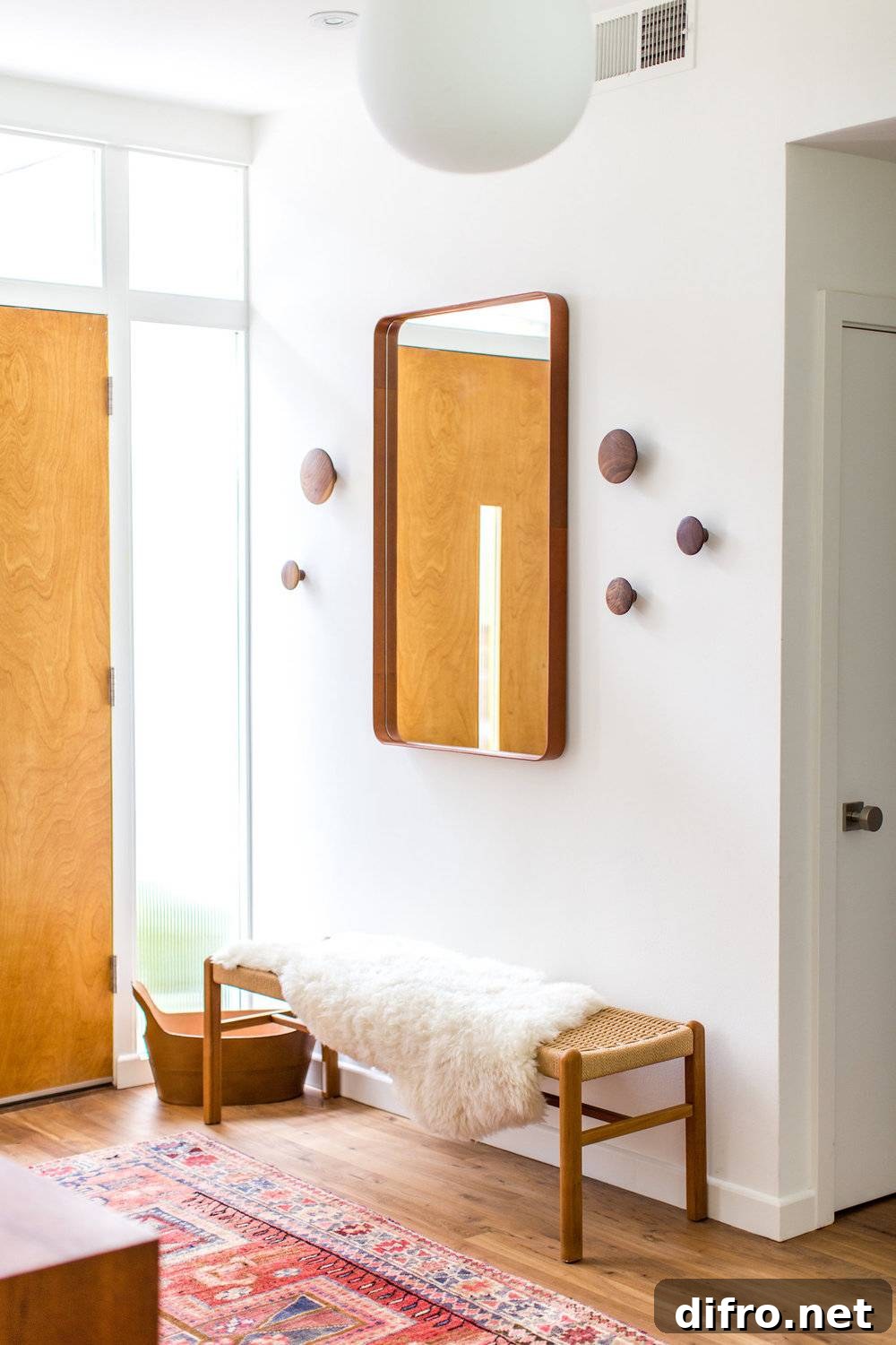 Simple entryway with a natural wood bench.