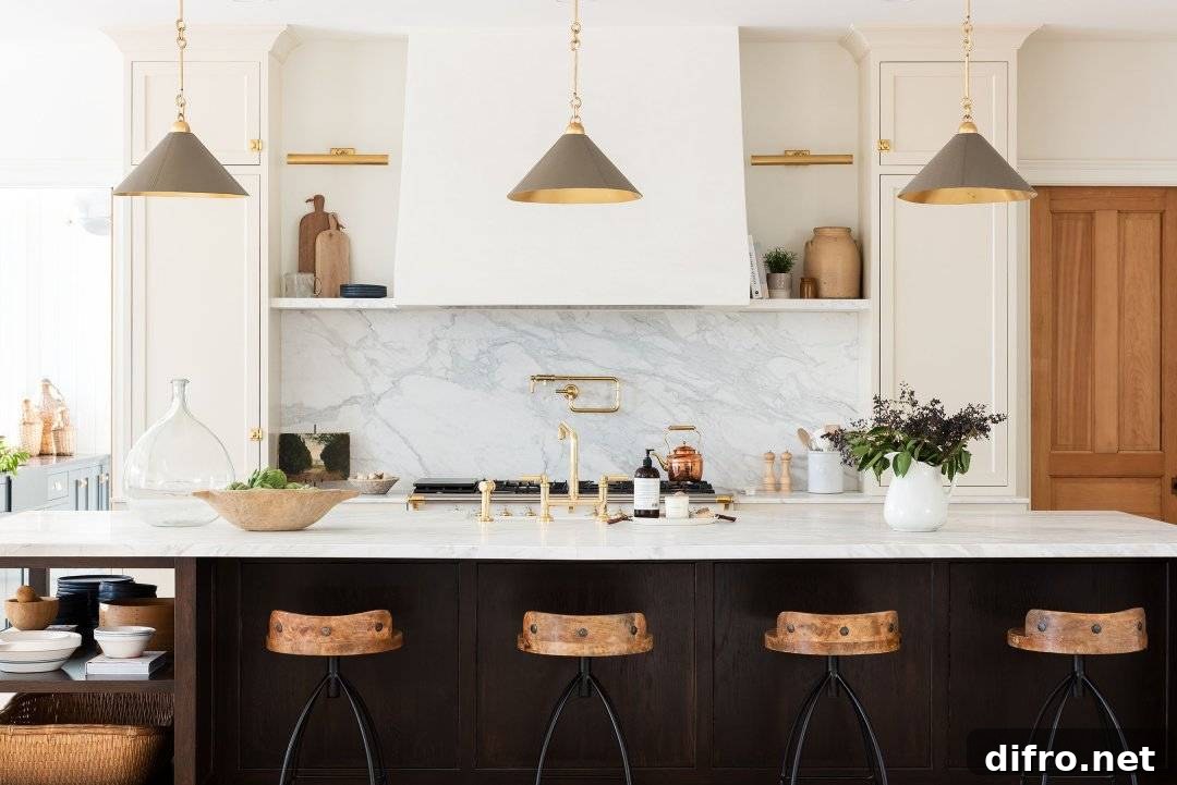 Rustic kitchen island highlighted by taupe pendant lights