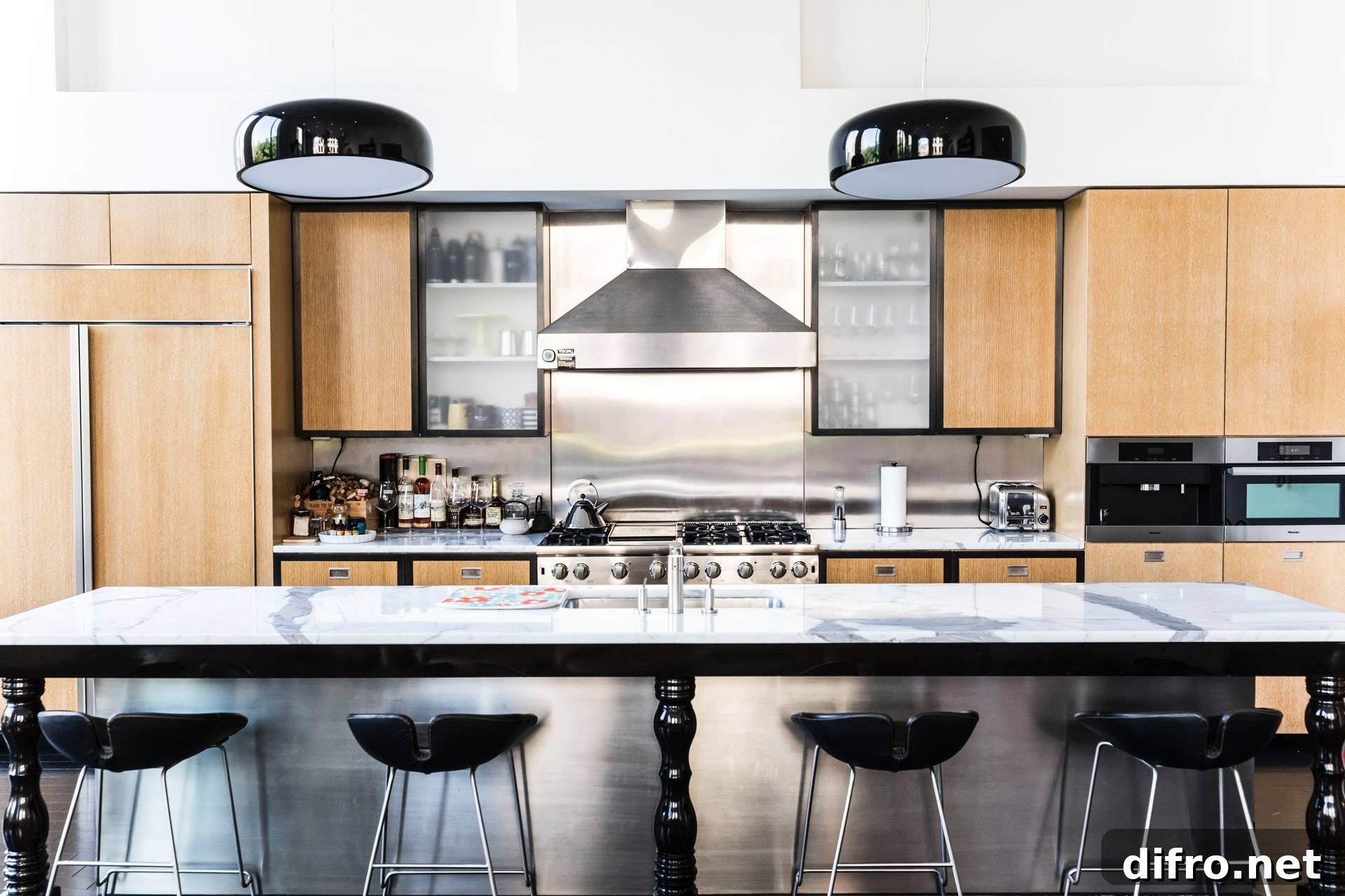 Kitchen showcasing black industrial pendant lights