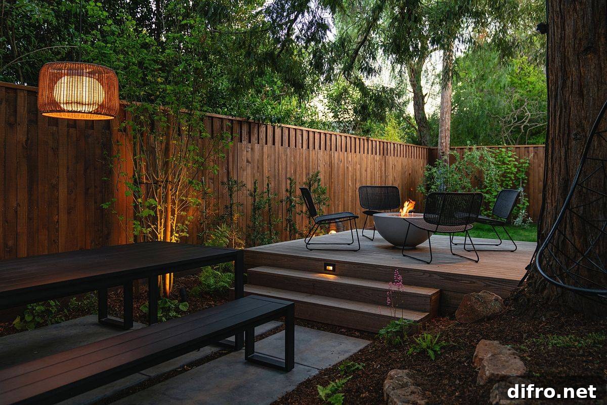 Small private urban deck surrounded by greenery with a sitting area