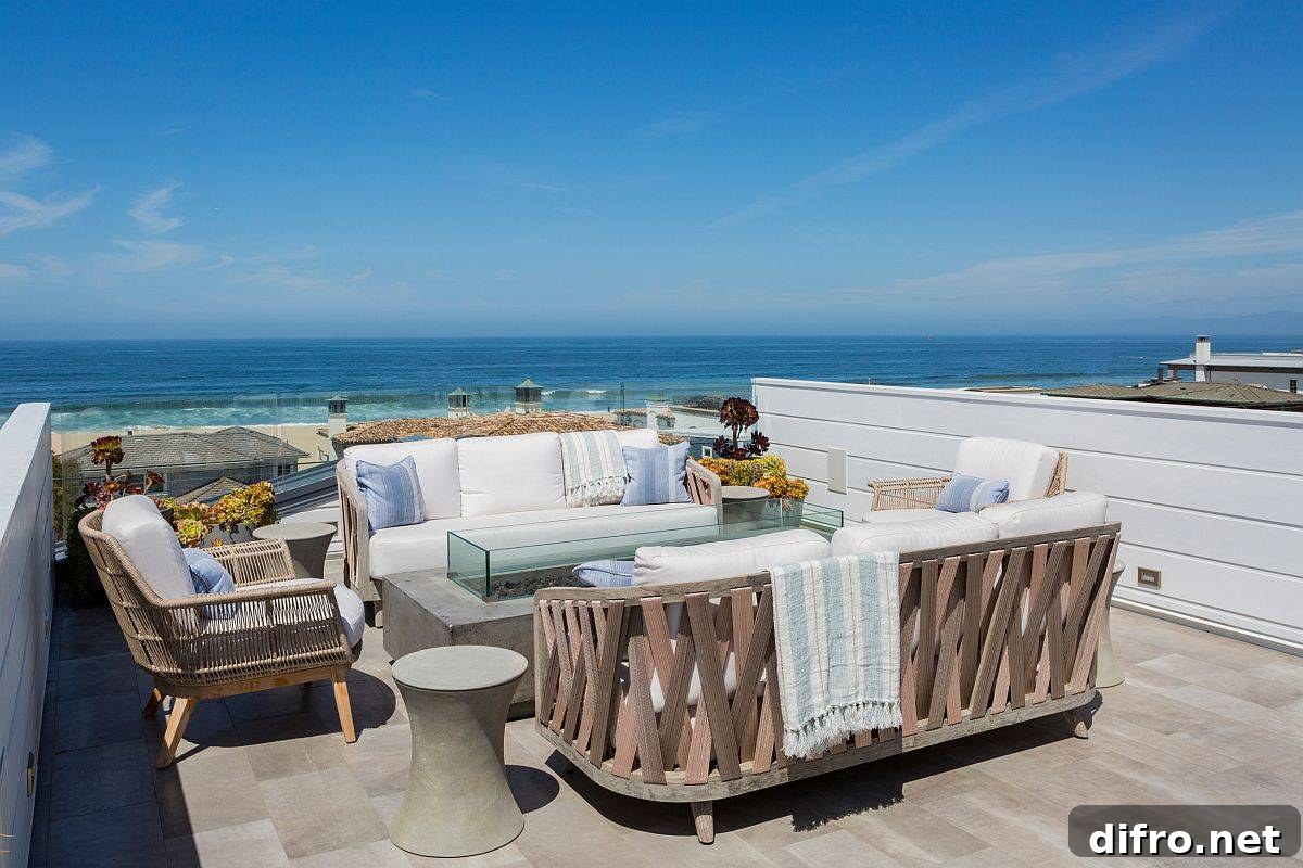 Beach-style deck with ocean views and fire pit