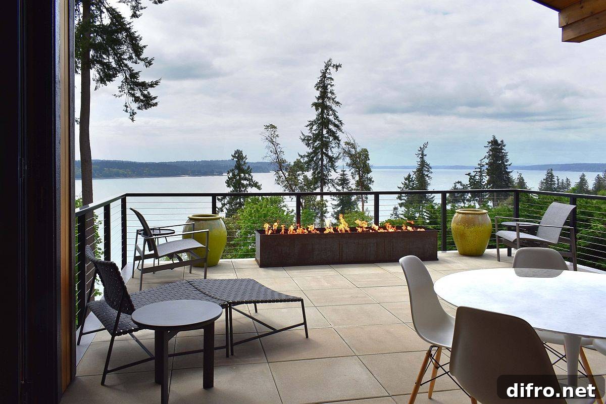 Spacious deck with river views and seating around a fire pit