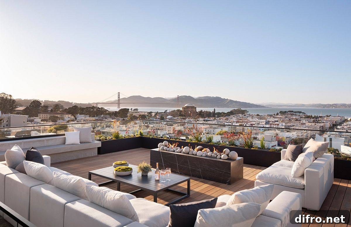 Contemporary rooftop deck with fireplace and city views