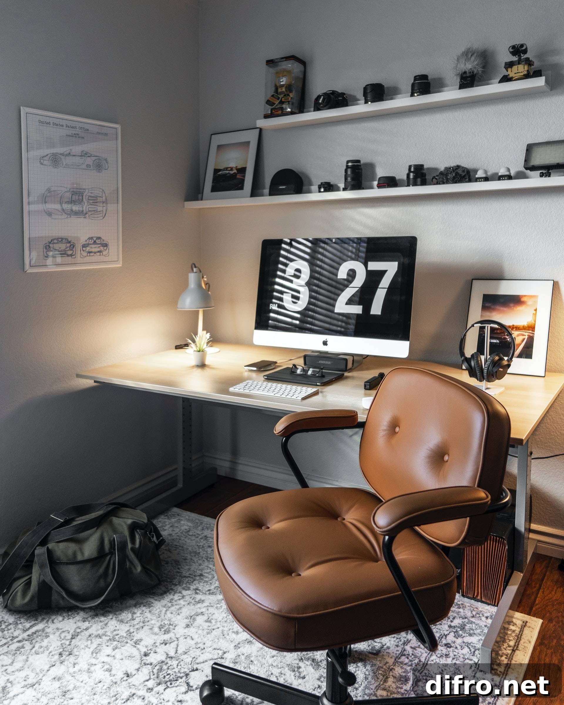 office setup with open shelves displaying camera lenses