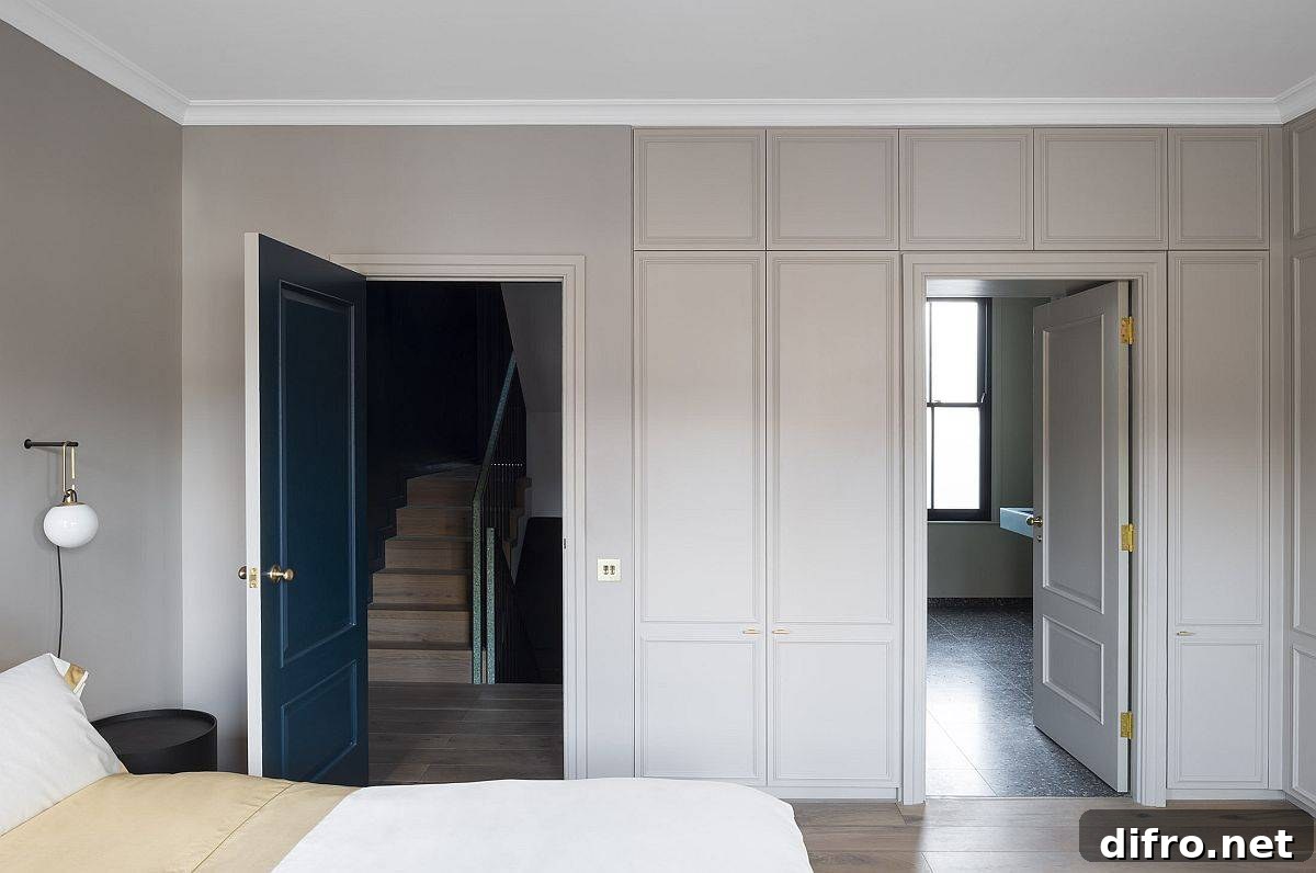 Master suite with brown and white tones and blue doors