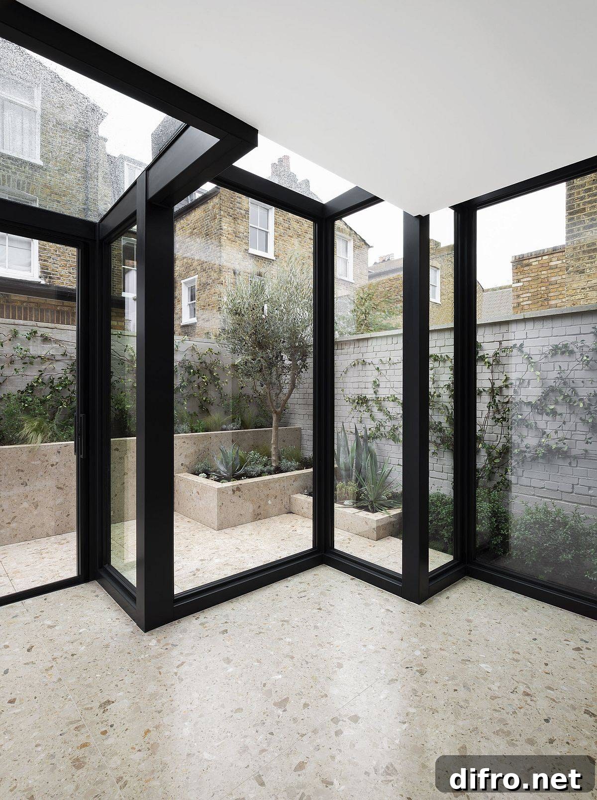 Glass boxes with metal frames extend the traditional home