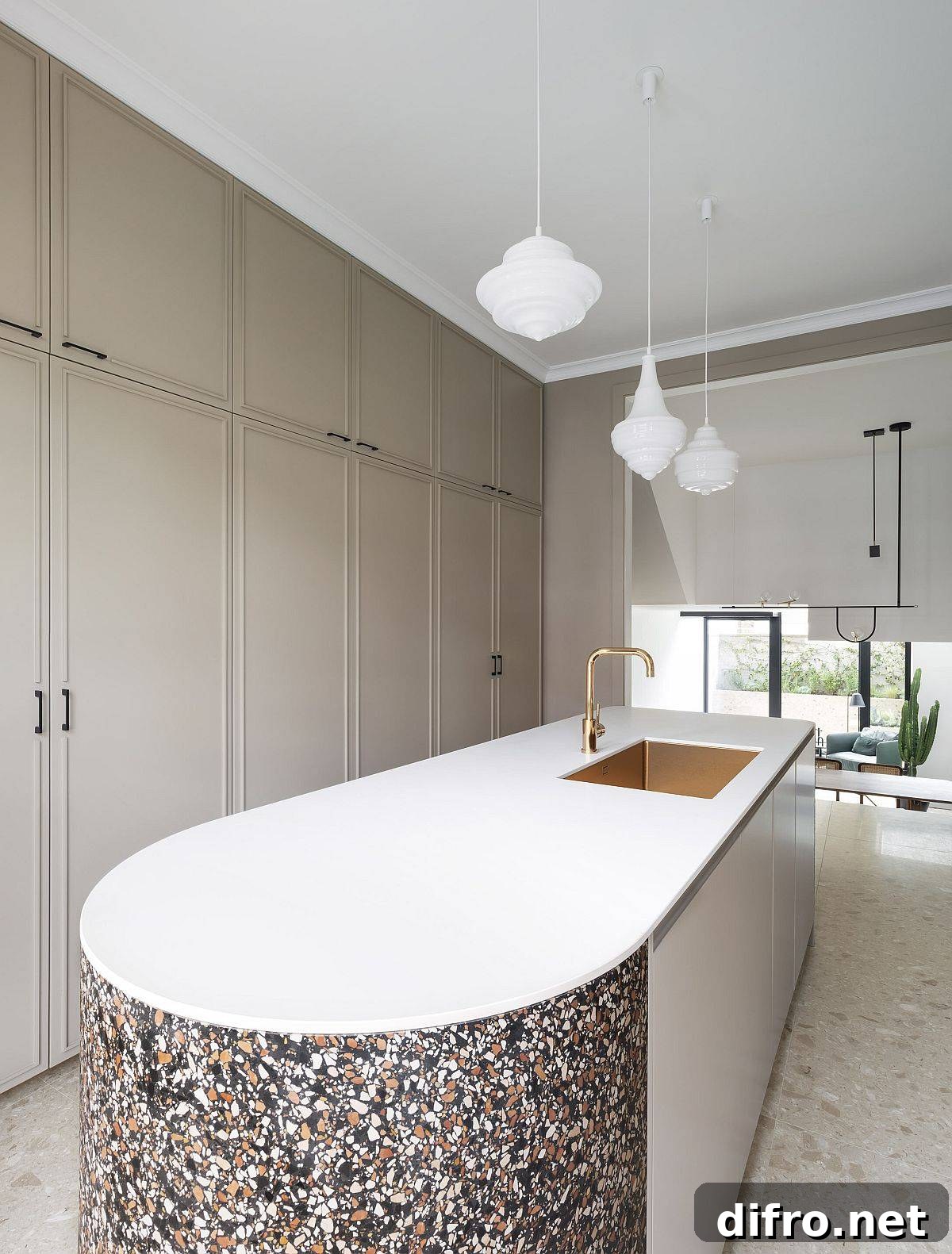 Kitchen island with rounded edge and terrazzo finish