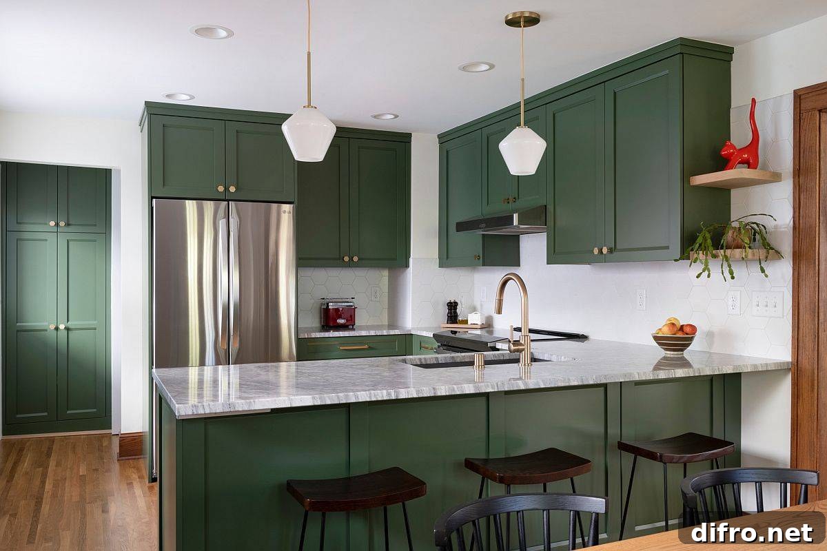 Deep green kitchen cabinets in a small contemporary kitchen