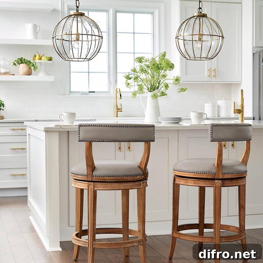 Glass cage pendant light over a kitchen island
