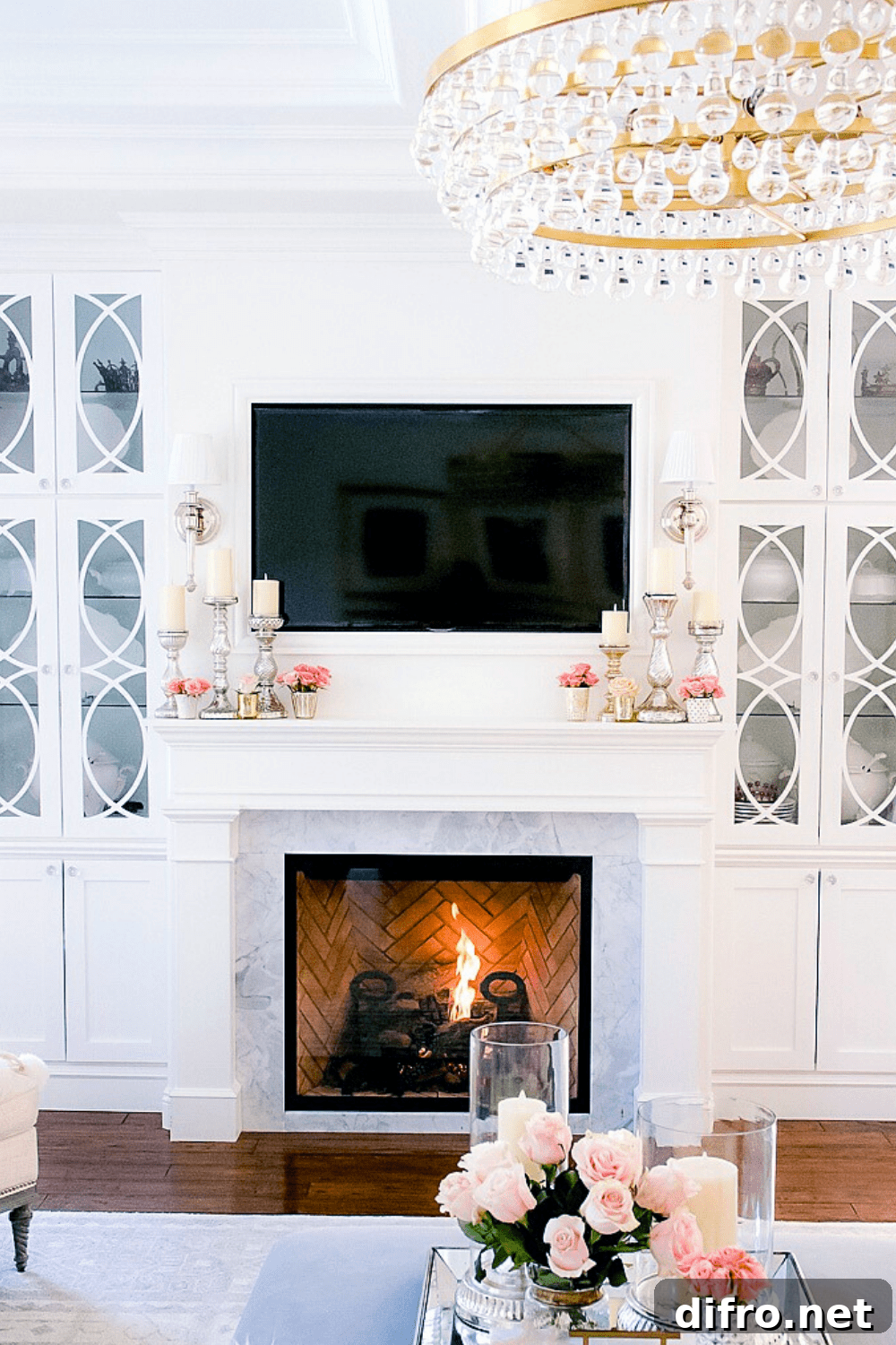 Elegant spring mantel with pink roses and white candles