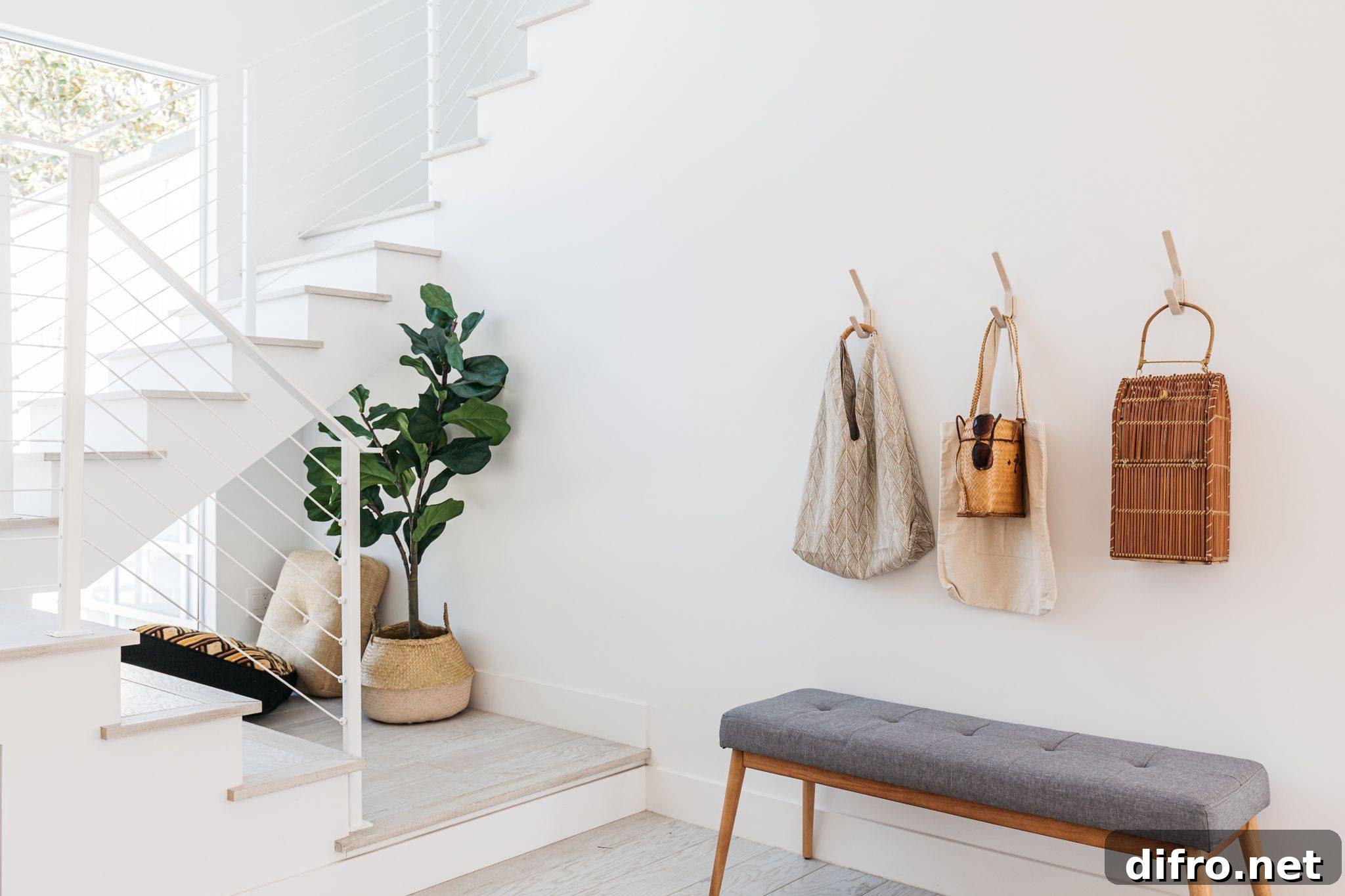 Minimalist small entryway with bench and hooks