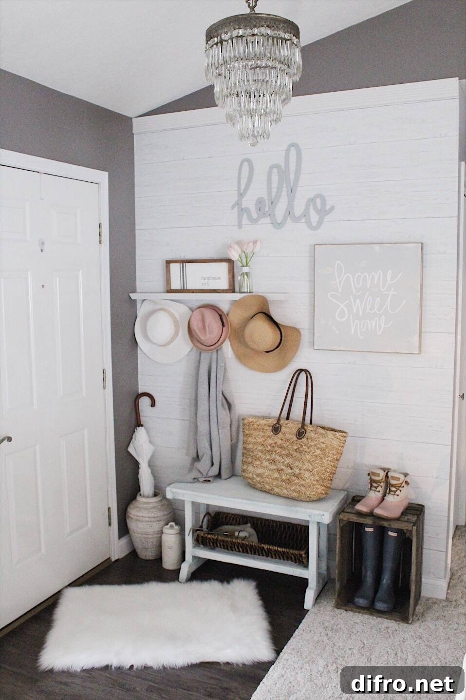 Entryway styled with wooden crate, woven tote and shiplap