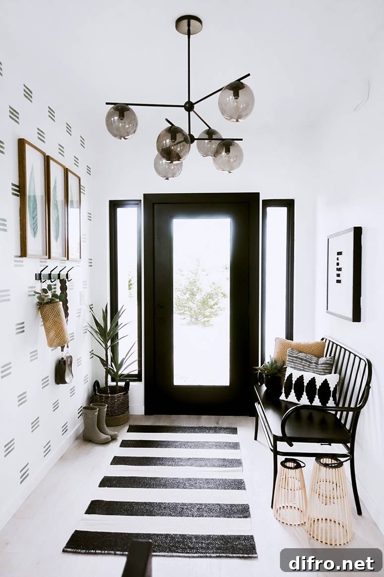 Compact entryway layout with bench, gallery wall and plant