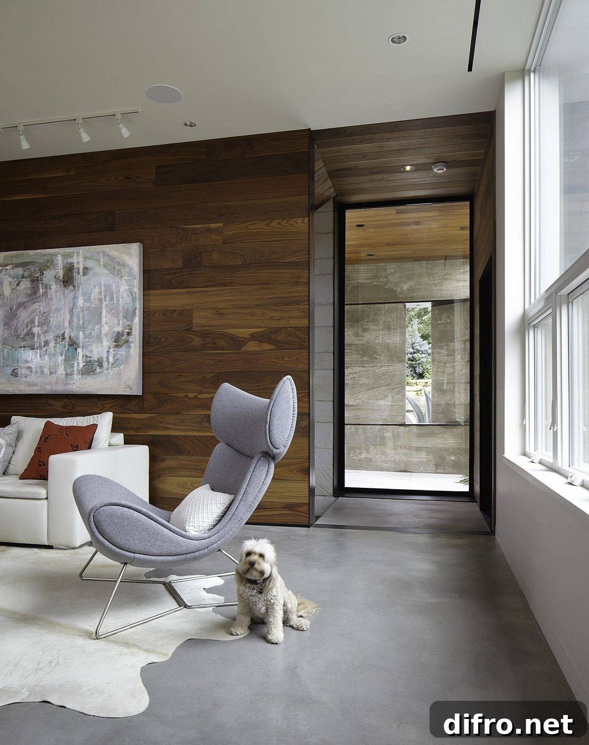 Cozy modern living room with wood walls and concrete flooring