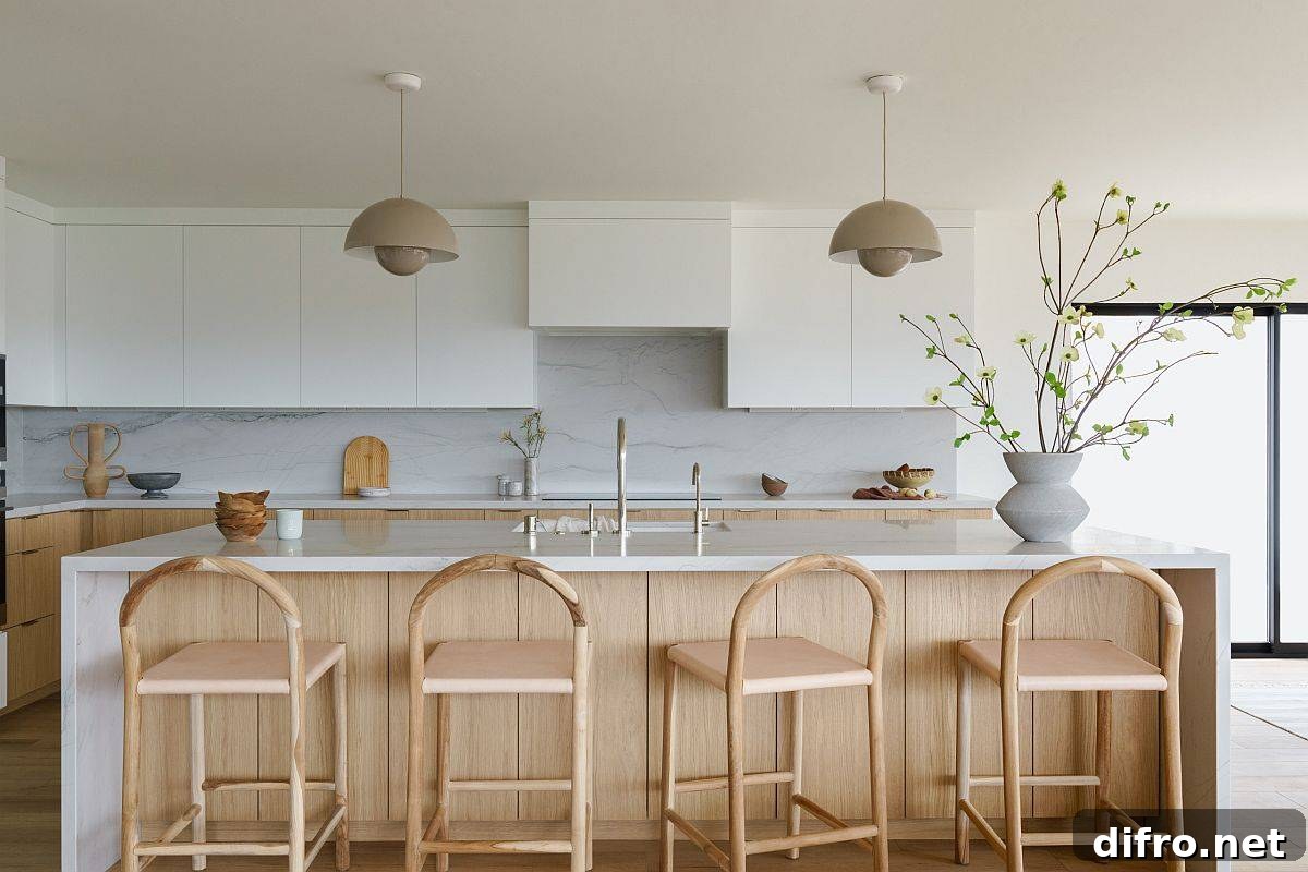 White and wood kitchen with white stone slab backsplash