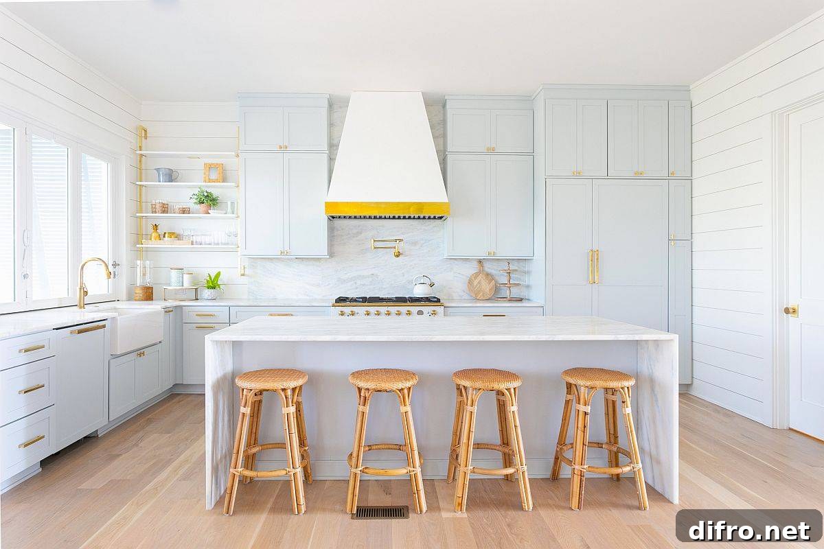 All-white kitchen with stone slab backsplash