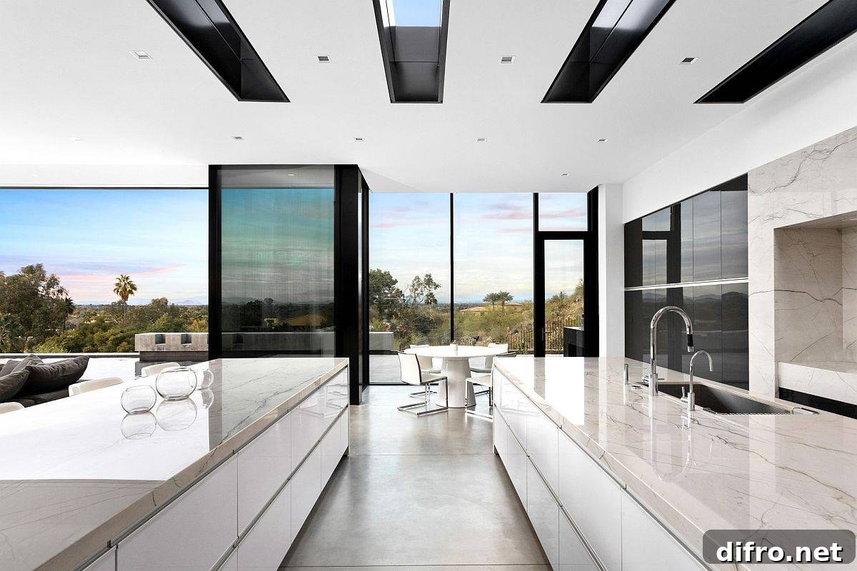 Kitchen and dining area with clerestory windows and landscape views
