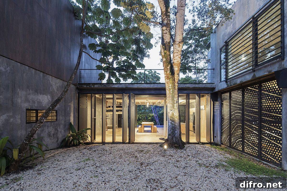Central courtyard preserving existing trees