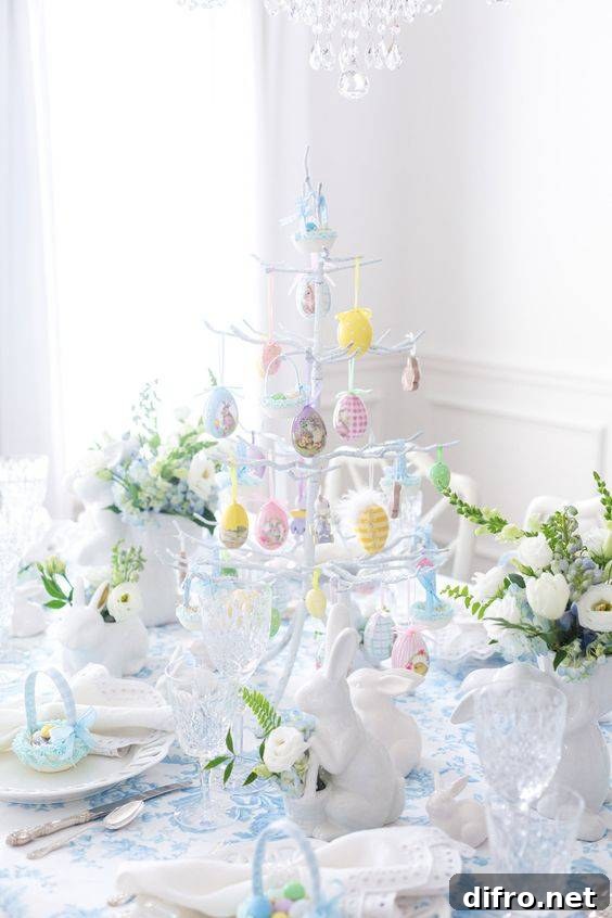 White and blue table setting with Easter egg tree