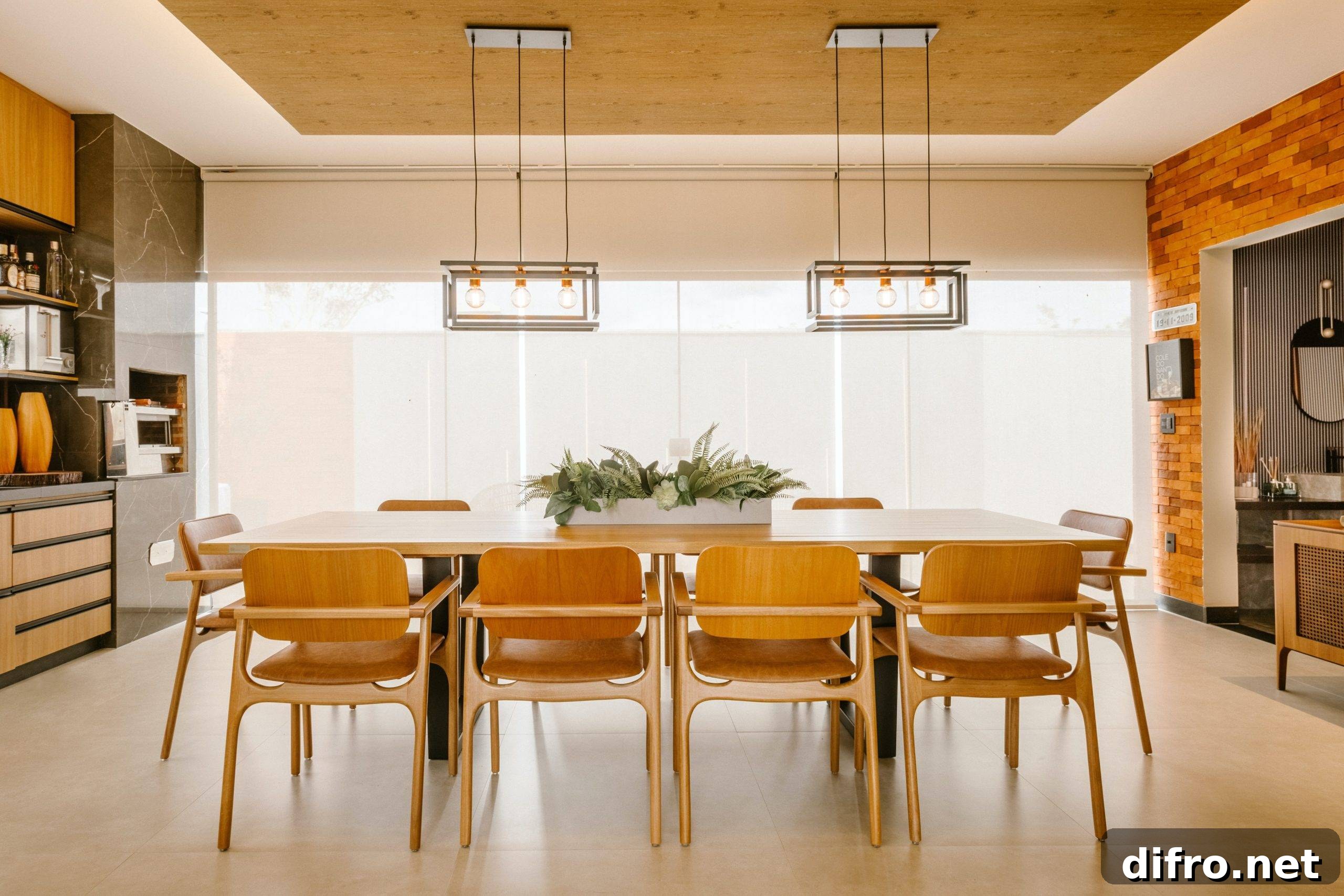 dining room with teak table and two hanging chandeliers
