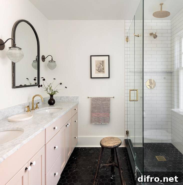 pink vanity black tile mirror gold fixtures walk in shower bathroom