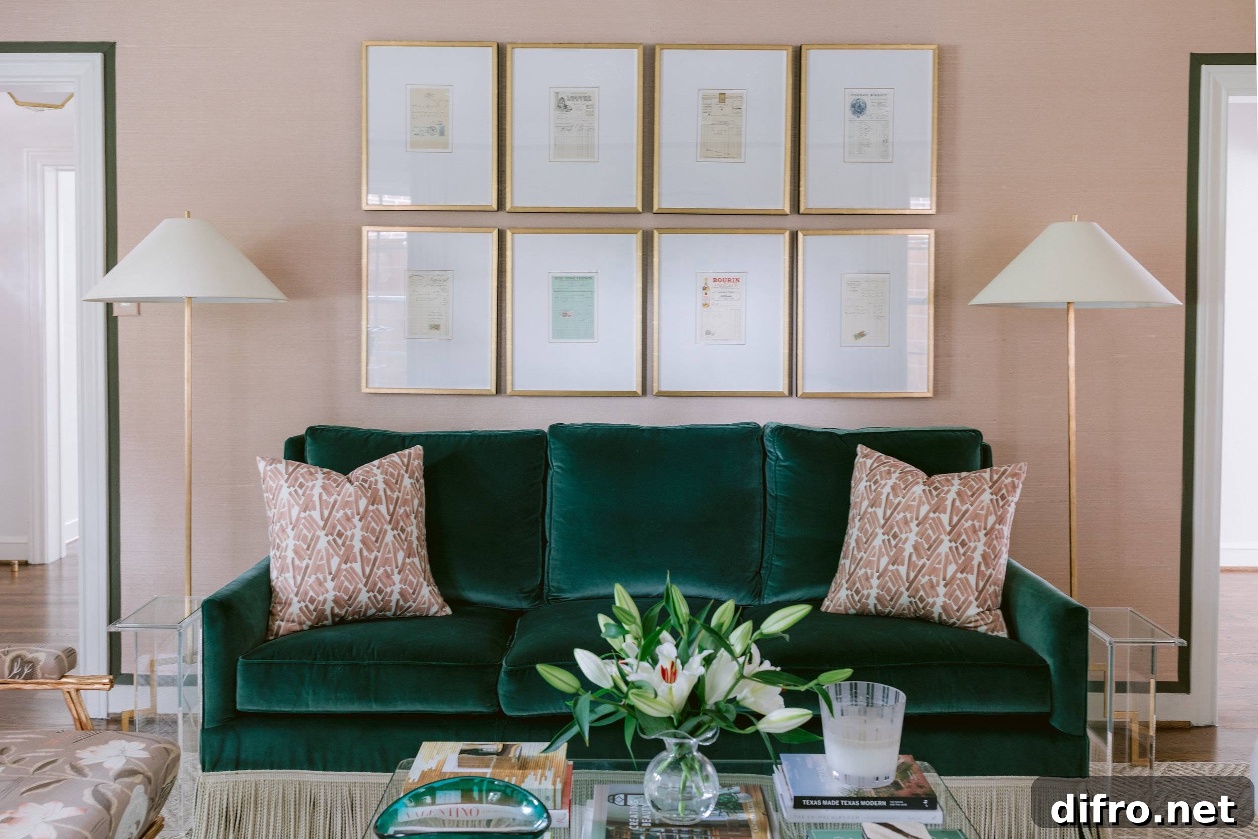 living room with pink and emerald couch and gallery wall art pillows