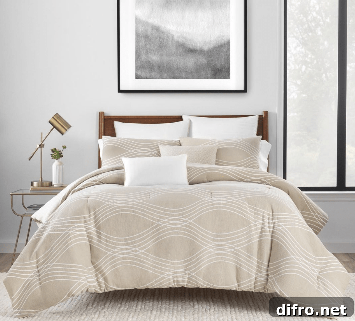 bedding master bed with tan bed covering white pillows in room with lamp on nightstand