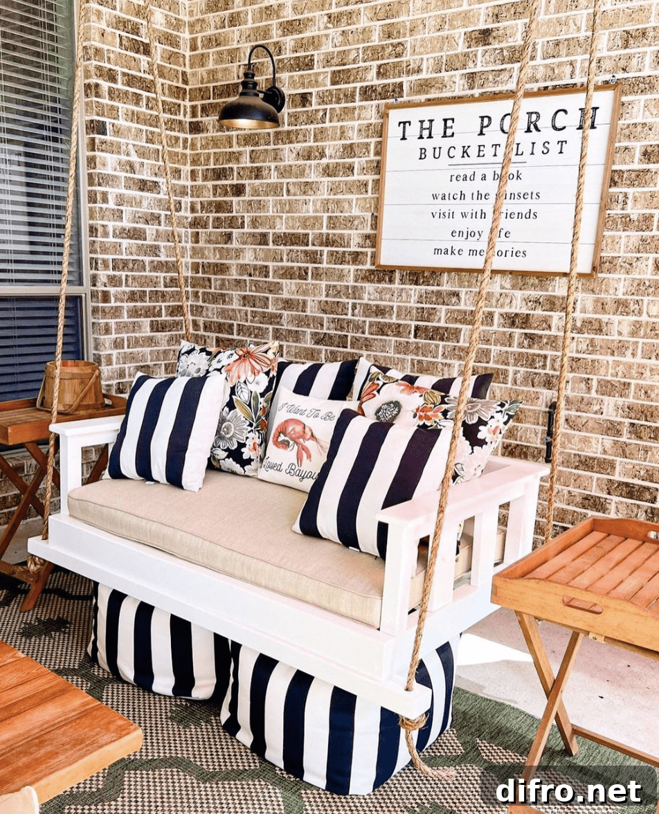 black and white striped pillow porch swing matching ottomans brick porch hanging wall sconce porch sign