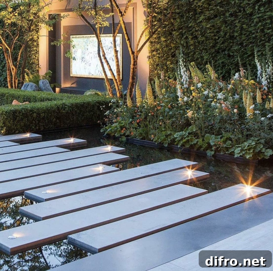 modern flat cement garden steps walkway with lit up landscape lighting.