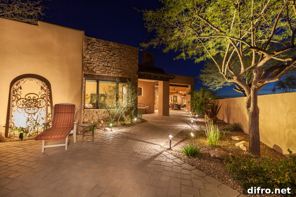 pathway lighting outside of stone house tree lounge chair