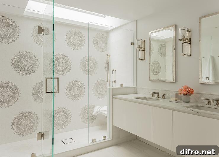 White and gray mosaic surround tiles in a seamless glass shower