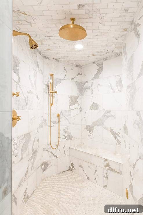 brass rain shower kit fixed to marble subway ceiling tiles over marble lattice floor tiles
