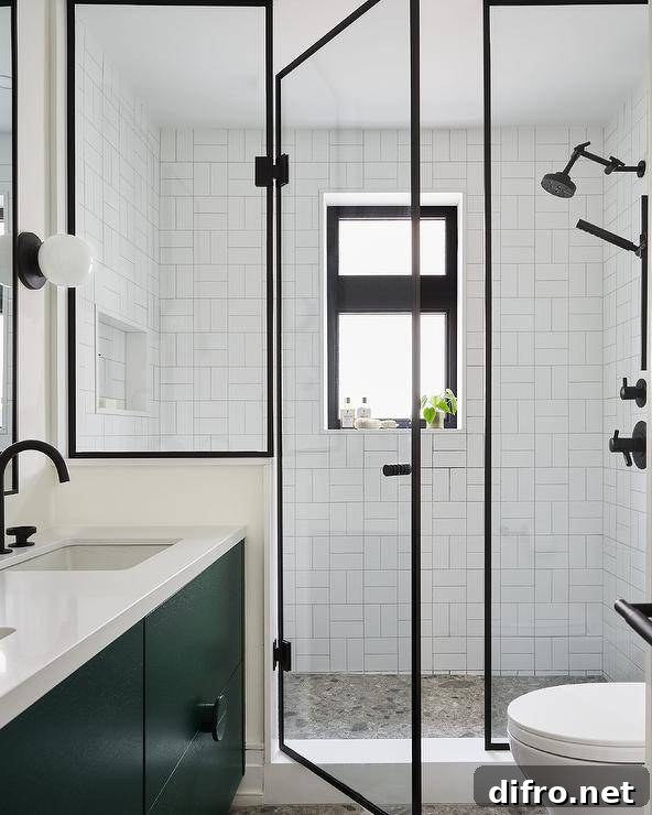 steel and glass shower door enclosure accent walk-in shower with an oil rubbed bronze shower head mounted against white subway basketweave wall tiles