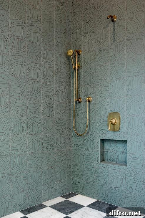 green and black stacked wall tiles with brass fixtures