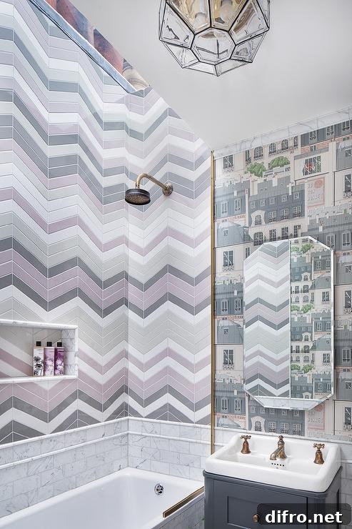 Bathroom with pink and gray chevron pattern tiles and patterned wallpaper
