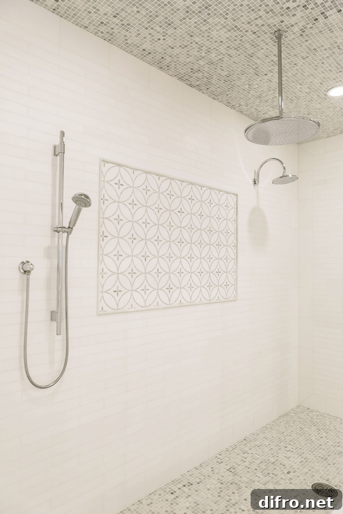 white linear tile surround in shower accented with decorative inset tiles