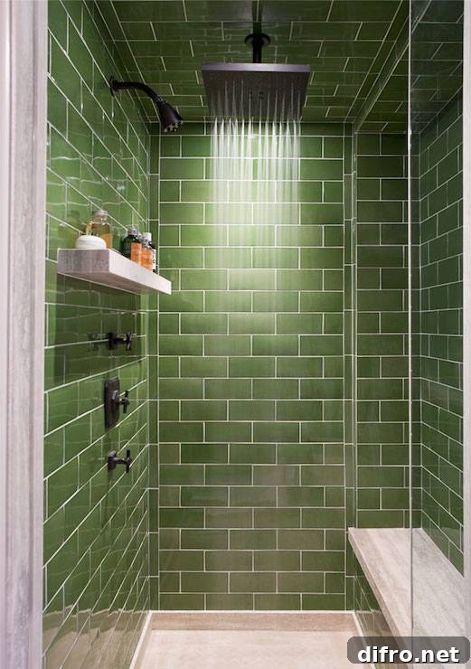 Walk-in shower green subway tile surround and ceiling accented with ceiling mounted square rain shower head