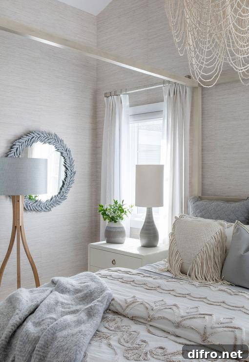 gray and cream theme bedroom with wall mirror post bed with chandelier
