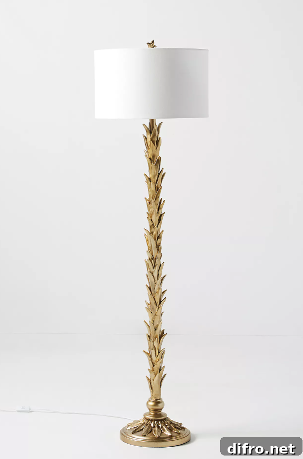 Brass floor lamp with white shade