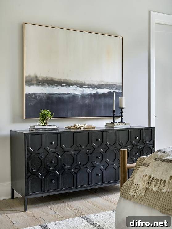 gray and black abstract art gold frame over black console