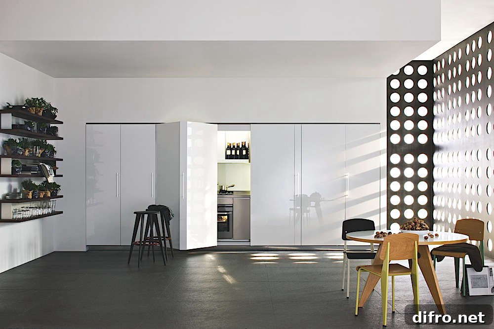 white hidden kitchen behind accordion doors