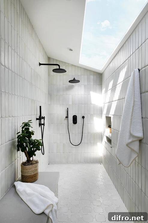 43 Walk-In Shower Ideas to Transform Your Bathroom 11 sloped ceiling walk in shower with skylight window black faucets hanging white towel