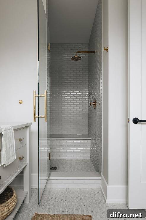 43 Walk-In Shower Ideas to Transform Your Bathroom 16 grey subway tile walk in shower with gold faucets glass door with gold hardware