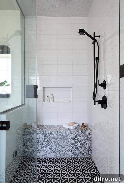 43 Walk-In Shower Ideas to Transform Your Bathroom 18 black and white marble tile bench in walk in shower with black faucets white subway tile and mosaic floor tiles glass door