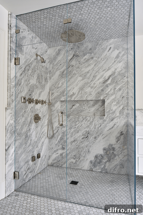 43 Walk-In Shower Ideas to Transform Your Bathroom 4 grey marble walk in shower with circle floor tiles chrome shower kit floor to ceiling glass doors