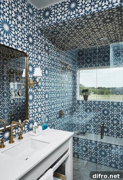 43 Walk-In Shower Ideas to Transform Your Bathroom 20 blue mosaic tiles floor to ceiling walk in shower with frameless glass doors gold faucet white counter sink gold mirror wall sconce