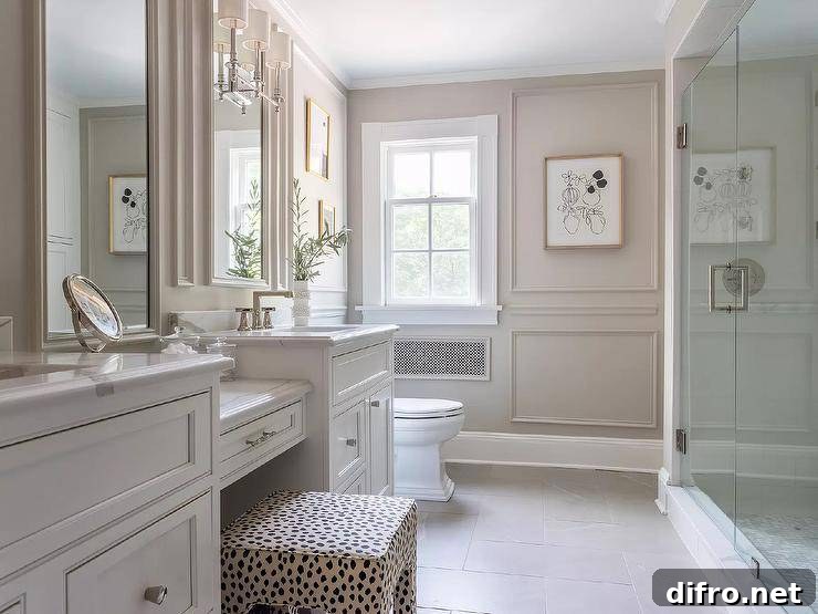 Makeup vanity with a stool in a sophisticated master bathroom