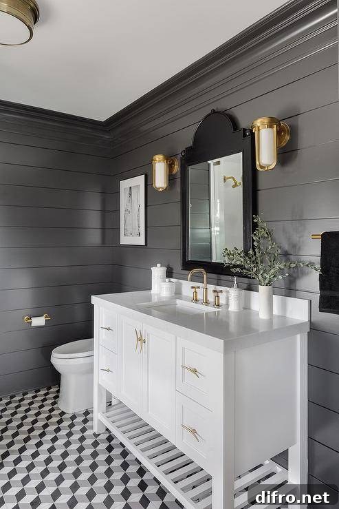 Formal black and white bathroom with marble and brass accents